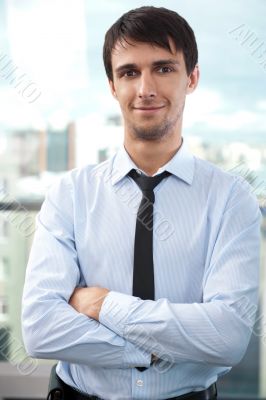 Portrait of young relaxed business man