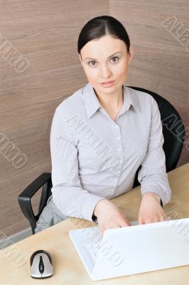 Portrait of a beautiful young businesswoman on the computer, loo