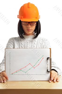 Young architect-woman wearing a protective helmet