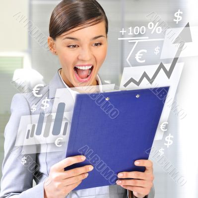Portrait if young business woman at her office holding report