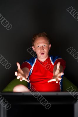 Closeup portrait of young man wearing sportswear fan of football