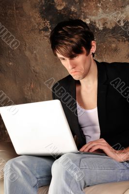 Happy businessman using laptop