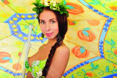 Portrait of young woman with beach umbrella 