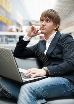 Portrait of hand"magenta">some young man working wit