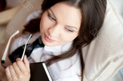 Young sexy woman at home reading book 