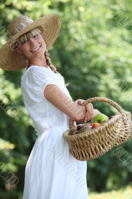 young woman with a basket of fruits