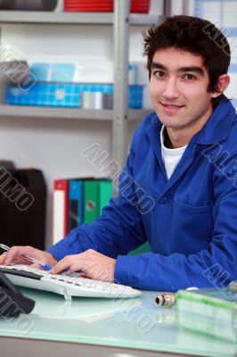 Young apprentice doing paperwork.