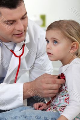 A doctor with a little girl.