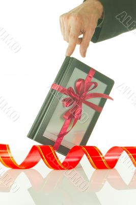 Man`s hand holds electronic book reader