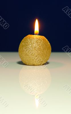 Golden burning candle