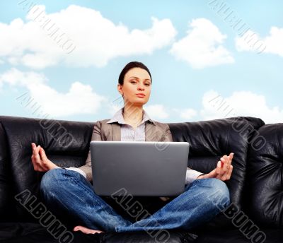 Portrait of young business woman sitting with a laptop"lime