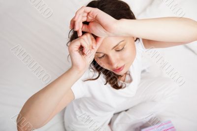 Portrait of a charming young lady relaxing on </span