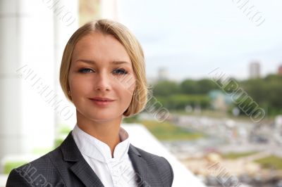 Closeup portrait of cute young business woman smiling