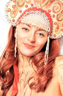 Closeup portrait of pretty young woman with red hairs posing nea