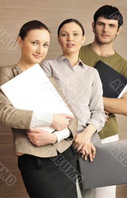 Portrait of three office workers.