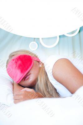 Closeup portrait of a cute young woman sleeping on the bed weari