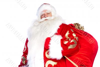 Santa Claus standing up on white background with his bag full of
