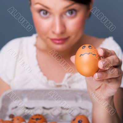 Portrait of young pretty business woman against grey background 