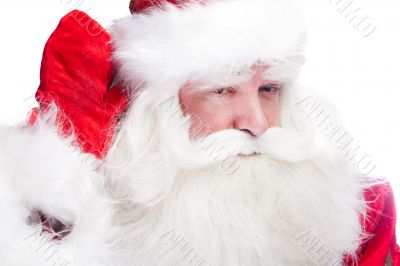 Traditional Santa Claus looking for children and holding his han