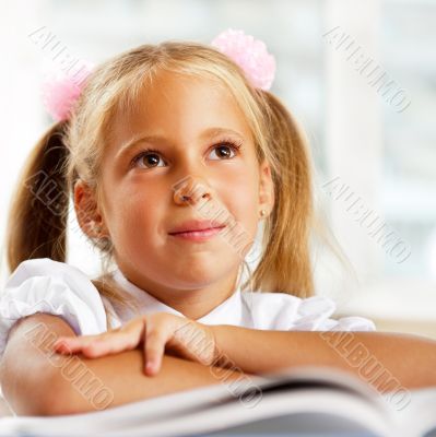 Portrait of a young girl in school at the d<s