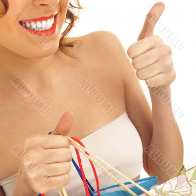 Portrait of lovely woman with shopping bags over white