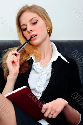 Happy woman sitting at office using pd