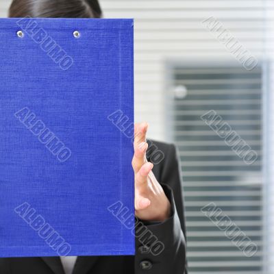A portrait of a young business woman in an of