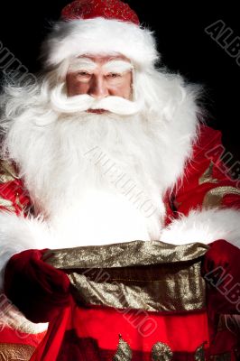 Santa sitting at the Christmas room and looki