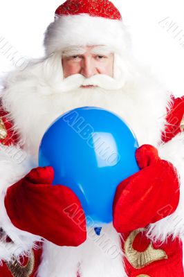 Traditional Santa Claus holding balloons for childre