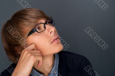 Image of young man thinking of his plans