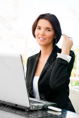 Young business woman on a laptop using wireless internet connect