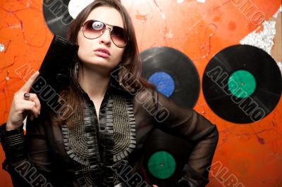 Portrait of a bright beautiful young woman with fashion sunglass