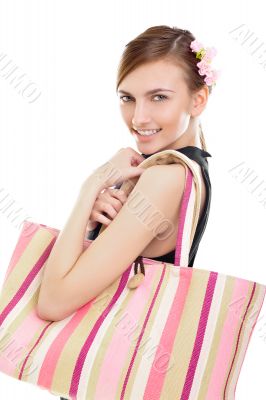 Portrait of a happy young woman woman with her handbag