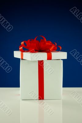 Open white box with present