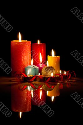 A lot of burning colorful candles