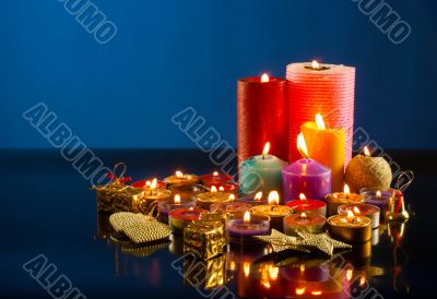 A lot of burning colorful candles