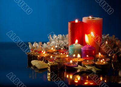 A lot of burning colorful candles
