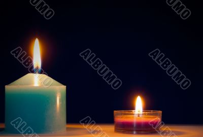 Two burning candles