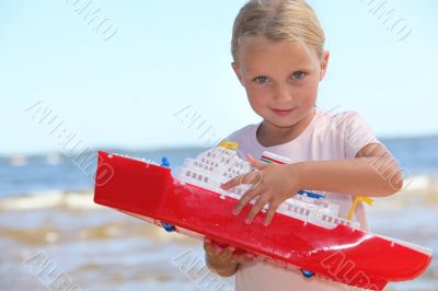Girl playing with boat