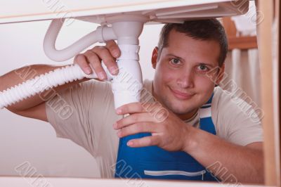 portrait of a young plumber