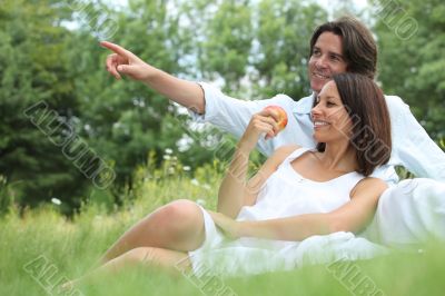 Couple sitting in the grass