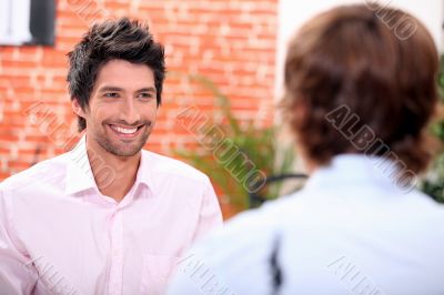 a man at restaurant with someone