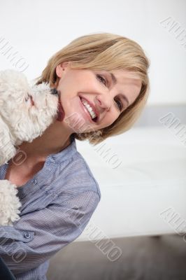 Dog licking woman