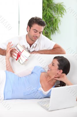 Boyfriend offering gift to girl