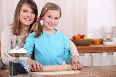 mother and daughter cooking together