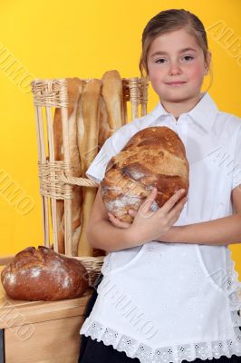 Young girl with fresh bread