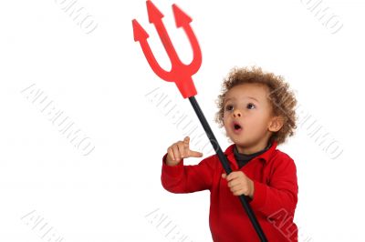 Young child holding up a devil`s fork