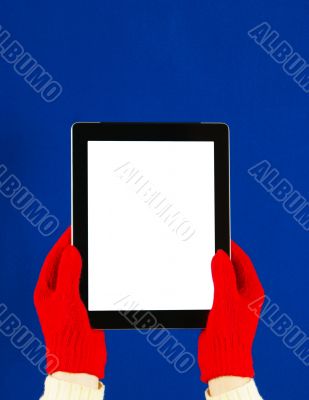 Hands wearing red gloves holding a tablet PC