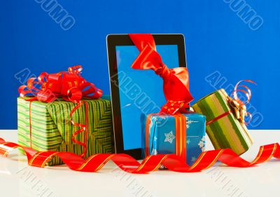 Presents with a tablet pc against blue background