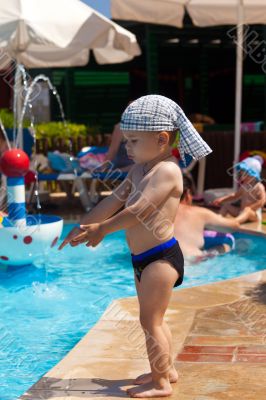 The little boy at children pool